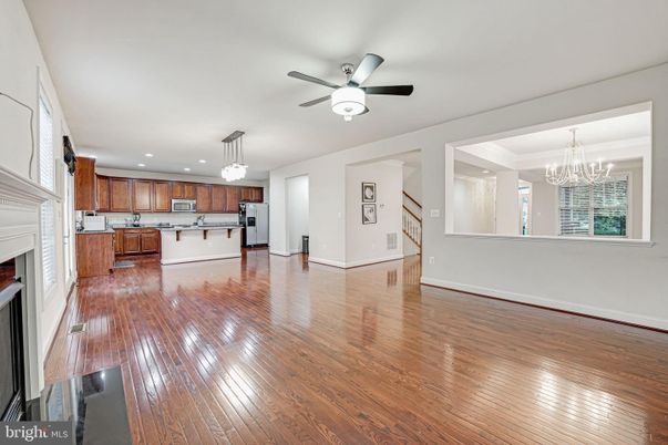 Chandelier, Fireplace, Interior, Kitchen, Pendant Lights, Recessed Lighting, Wood Texture Flooring