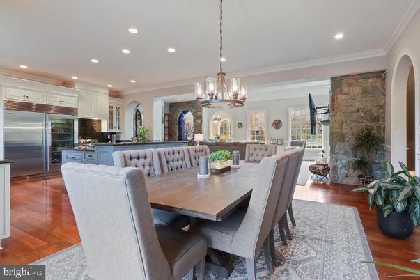 Chandelier, Dining room, Interior, Kitchen, Pendant Lights, Recessed Lighting, Stainless Steel Appliances, Stone Walls, Wood Texture Flooring