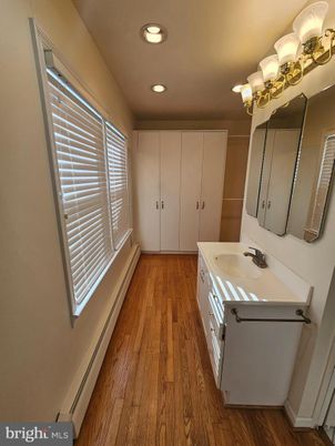 Bathroom, Dual Sink Vanities, Interior, Recessed Lighting, Wood Texture Flooring