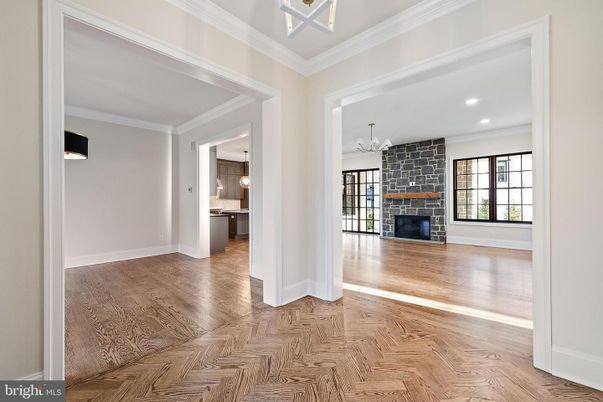 Empty room, Fireplace, Interior, Kitchen, Recessed Lighting, Stone Walls, Wood Texture Flooring