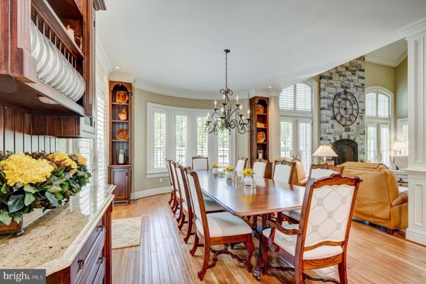 Chandelier, Dining room, Fireplace, Interior, Living room, Recessed Lighting, Stone Walls, Wood Texture Flooring