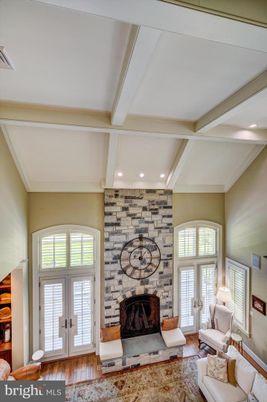 Fireplace, Interior, Living room, Recessed Lighting, Stone Walls, Wood Texture Flooring