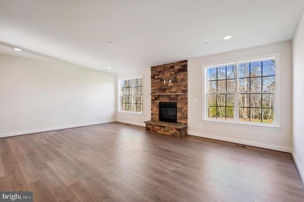 Empty room, Fireplace, Interior, Recessed Lighting, Stone Walls, Wood Texture Flooring