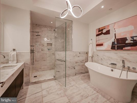Bathroom, Dual Sink Vanities, Free Standing Baths, Glass Shower, Interior, Marble, Marble Walls, Pendant Lights, Recessed Lighting