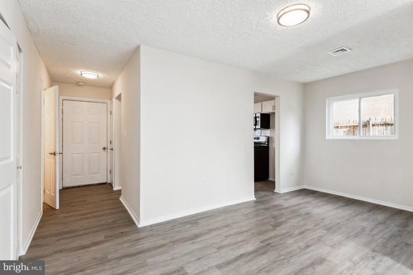 Empty room, Interior, Kitchen, Stainless Steel Appliances, Wood Texture Flooring