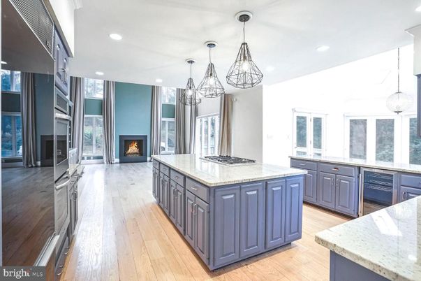 Fireplace, Interior, Kitchen, Pendant Lights, Recessed Lighting, Stainless Steel Appliances, Wood Texture Flooring