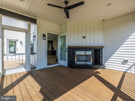 Exterior, Fireplace, Wood Texture Flooring