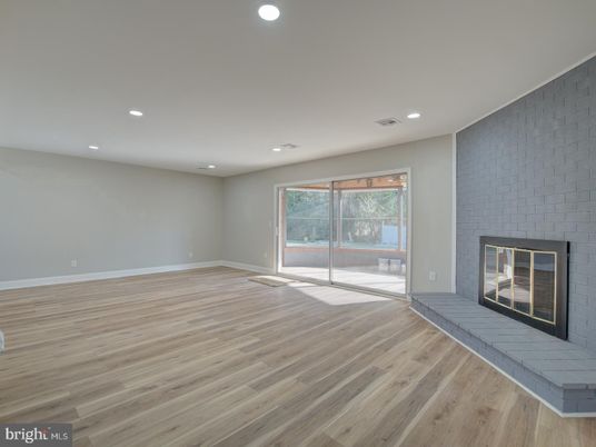 Empty room, Fireplace, Interior, Recessed Lighting, Stone Walls, Wood Texture Flooring