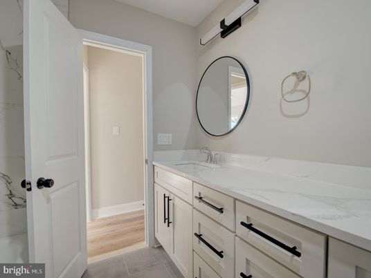 Bathroom, Dual Sink Vanities, Interior, Marble Walls, Wood Texture Flooring