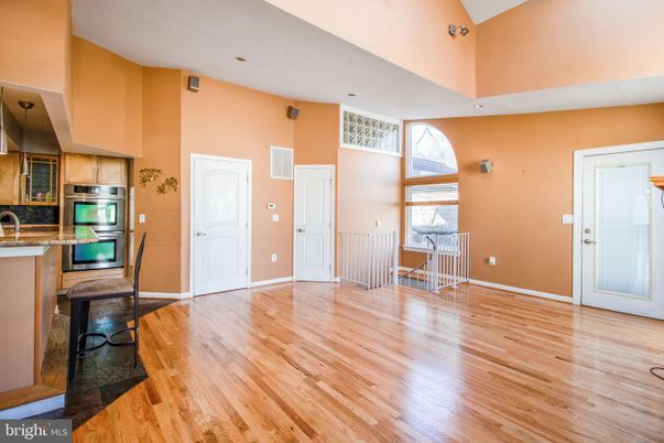 Fireplace, Interior, Kitchen, Recessed Lighting, Stainless Steel Appliances, Wood Texture Flooring