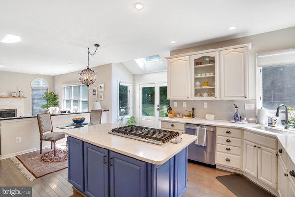 Chandelier, Dining room, Interior, Kitchen, Pendant Lights, Recessed Lighting, Stainless Steel Appliances, Wood Texture Flooring