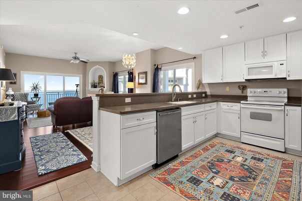 Chandelier, Dining room, Interior, Kitchen, Living room, Recessed Lighting, Stainless Steel Appliances, Wood Texture Flooring