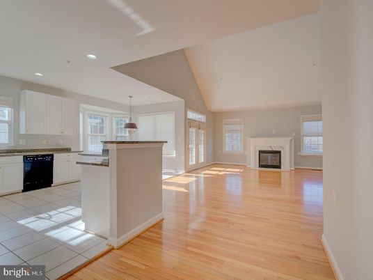 Empty room, Fireplace, Interior, Kitchen, Pendant Lights, Recessed Lighting, Wood Texture Flooring