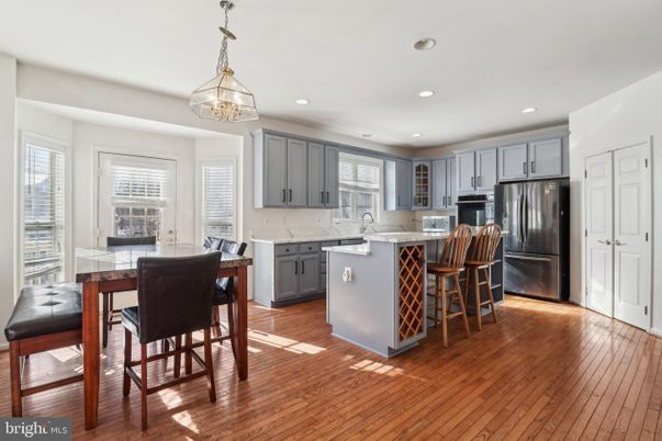 Dining room, Interior, Kitchen, Pendant Lights, Recessed Lighting, Stainless Steel Appliances, Wood Texture Flooring