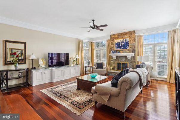 Fireplace, Interior, Living room, Recessed Lighting, Stone Walls, Wood Texture Flooring