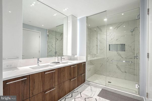 Bathroom, Dual Sink Vanities, Glass Shower, Interior, Marble, Marble Walls, Recessed Lighting