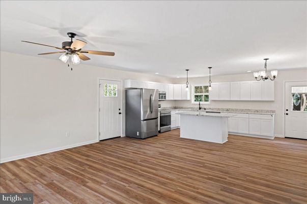 Chandelier, Interior, Kitchen, Pendant Lights, Recessed Lighting, Stainless Steel Appliances, Wood Texture Flooring
