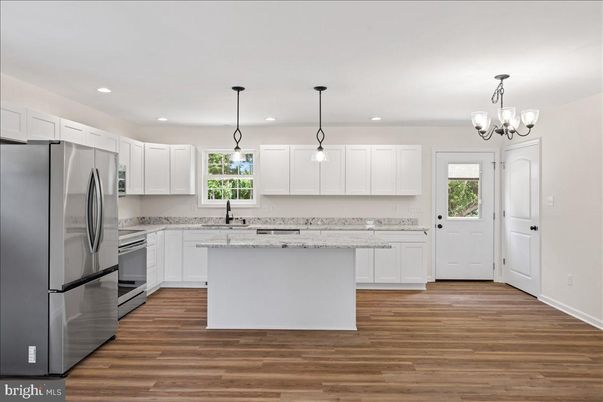 Chandelier, Interior, Kitchen, Pendant Lights, Recessed Lighting, Stainless Steel Appliances, Wood Texture Flooring