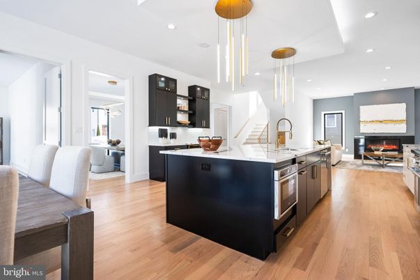 Fireplace, Interior, Kitchen, Living room, Pendant Lights, Recessed Lighting, Stainless Steel Appliances, Wood Texture Flooring