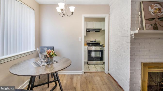 Fireplace, Interior, Kitchen, Pendant Lights, Stainless Steel Appliances, Stone Walls, Wood Texture Flooring