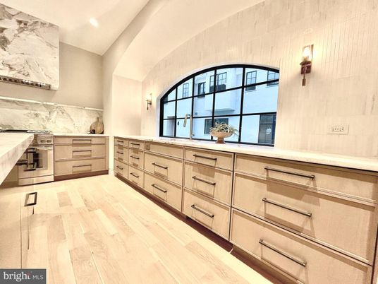 Interior, Kitchen, Marble Walls, Recessed Lighting, Stainless Steel Appliances, Wood Texture Flooring