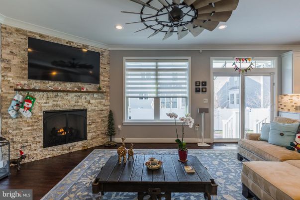 Fireplace, Interior, Living room, Recessed Lighting, Stone Walls, Wood Texture Flooring