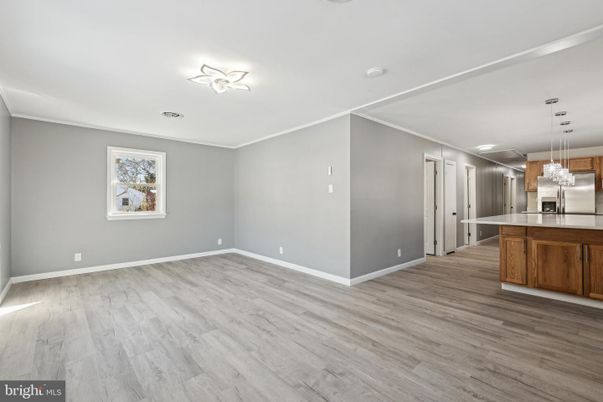 Empty room, Interior, Kitchen, Pendant Lights, Stainless Steel Appliances, Wood Texture Flooring