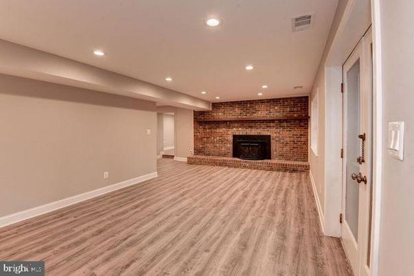 Fireplace, Interior, Recessed Lighting, Stone Walls, Wood Texture Flooring