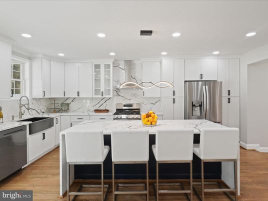Interior, Kitchen, Marble Walls, Pendant Lights, Recessed Lighting, Stainless Steel Appliances, Wood Texture Flooring