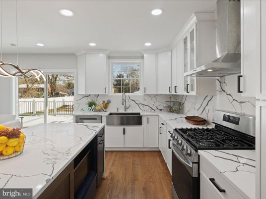 Interior, Kitchen, Marble Walls, Pendant Lights, Recessed Lighting, Stainless Steel Appliances, Wood Texture Flooring