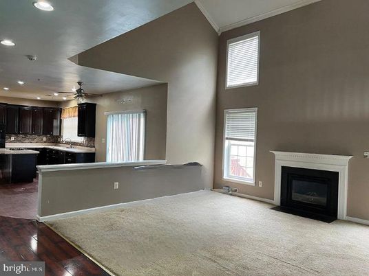 Empty room, Fireplace, Interior, Kitchen, Recessed Lighting, Wood Texture Flooring