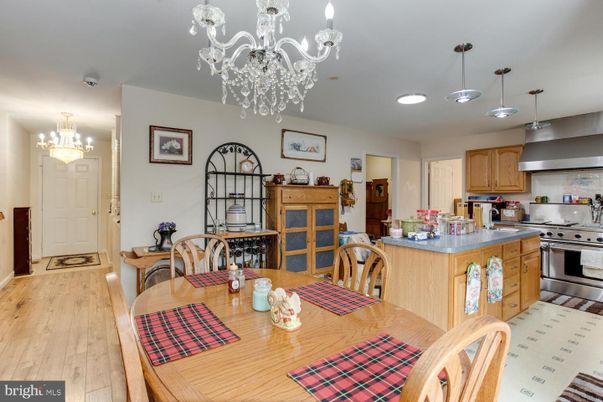 Chandelier, Dining room, Interior, Kitchen, Pendant Lights, Recessed Lighting, Stainless Steel Appliances, Wood Texture Flooring