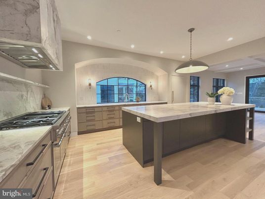 Interior, Kitchen, Marble Walls, Pendant Lights, Recessed Lighting, Stainless Steel Appliances, Wood Texture Flooring