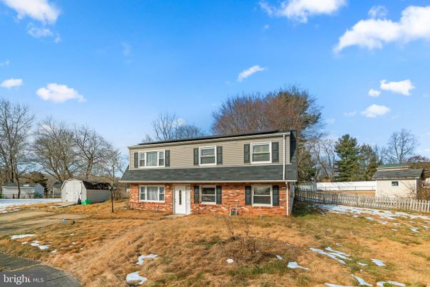 Backyard, Exterior, Facade, Brick Facade, Raised Ranch