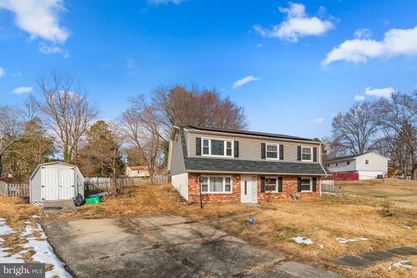 Backyard, Exterior, Facade, Brick Facade, Raised Ranch