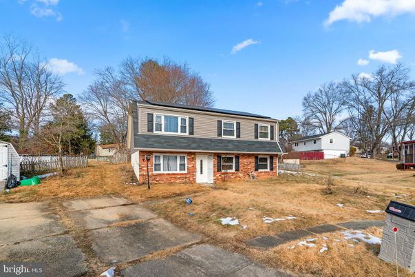Backyard, Exterior, Facade, Brick Facade, Solar Panels, Raised Ranch