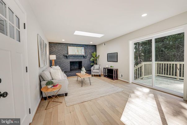 Fireplace, Interior, Living room, Recessed Lighting, Stone Walls, Wood Texture Flooring