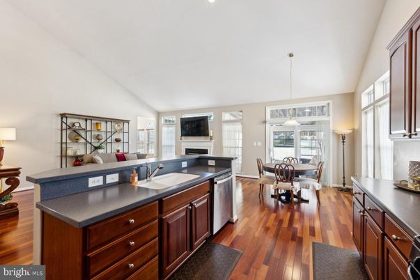Dining room, Fireplace, Interior, Kitchen, Living room, Pendant Lights, Wood Texture Flooring
