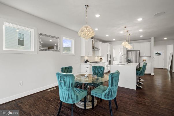 Chandelier, Dining room, Interior, Kitchen, Pendant Lights, Recessed Lighting, Stainless Steel Appliances, Wood Texture Flooring
