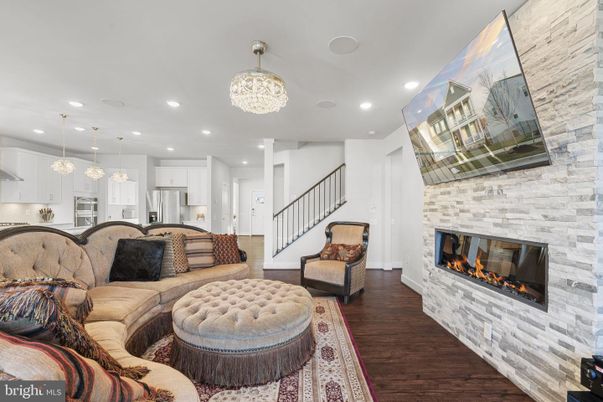Fireplace, Interior, Kitchen, Living room, Pendant Lights, Recessed Lighting, Stainless Steel Appliances, Stone Walls, Wood Texture Flooring