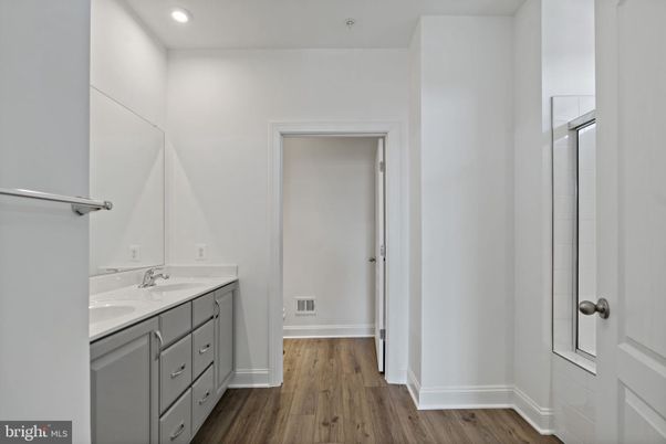 Bathroom, Dual Sink Vanities, Interior, Recessed Lighting, Wood Texture Flooring