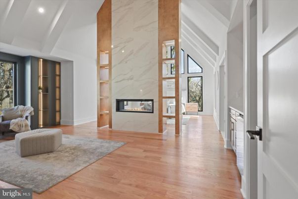 Fireplace, Interior, Marble Walls, Recessed Lighting, Wood Texture Flooring