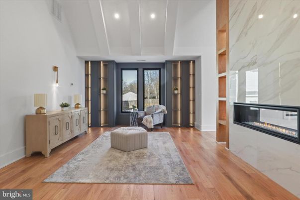 Fireplace, Interior, Marble Walls, Recessed Lighting, Wood Texture Flooring