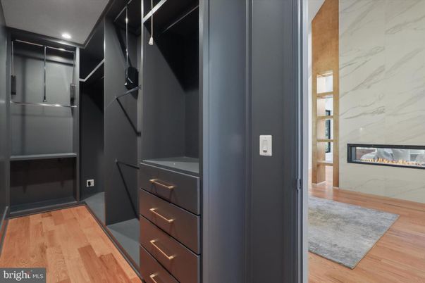 Fireplace, Interior, Marble Walls, Recessed Lighting, Walk-in Closets, Wood Texture Flooring