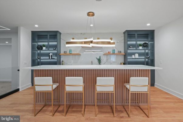 Interior, Kitchen, Marble Walls, Pendant Lights, Recessed Lighting, Stainless Steel Appliances, Wood Texture Flooring