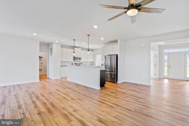 Empty room, Interior, Kitchen, Pendant Lights, Recessed Lighting, Stainless Steel Appliances, Wood Texture Flooring