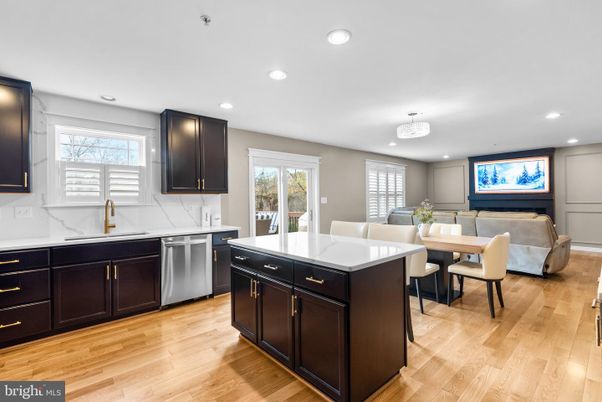 Chandelier, Dining room, Interior, Kitchen, Living room, Recessed Lighting, Stainless Steel Appliances, Wood Texture Flooring
