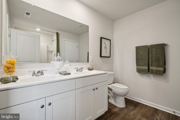 Bathroom, Dual Sink Vanities, Interior, Recessed Lighting, Wood Texture Flooring