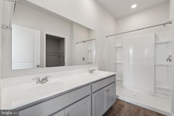 Bathroom, Dual Sink Vanities, Interior, Recessed Lighting, Walk-in Closets, Wood Texture Flooring