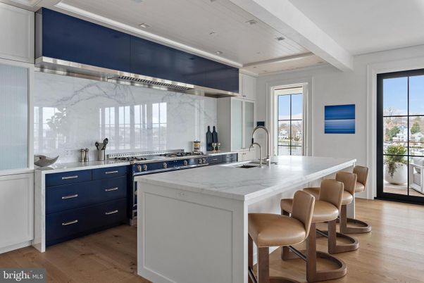 Interior, Kitchen, Marble Walls, Recessed Lighting, Stainless Steel Appliances, Wood Texture Flooring